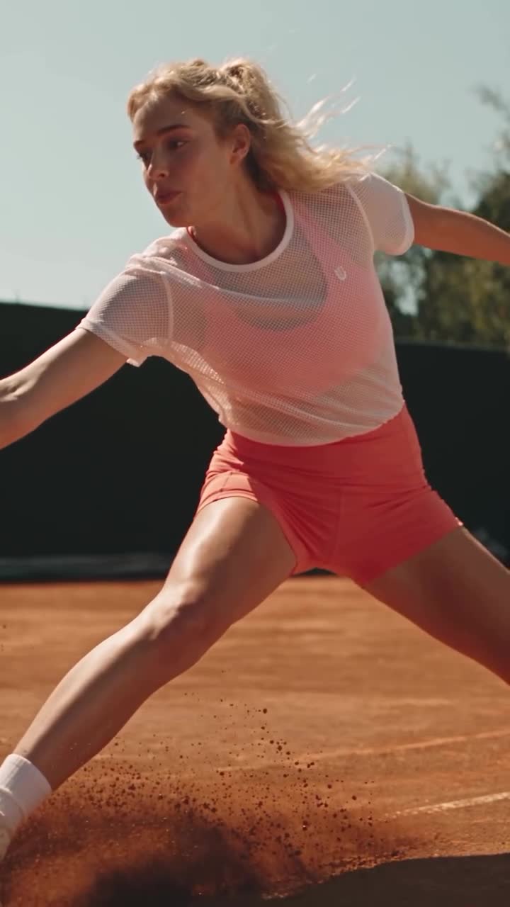 Activewear campaign featuring tennis on a sunlit clay court